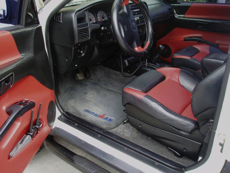 Illustration for article titled For $13,500, This 1999 Isuzu VehiCROSS Could Let You Pretend You're Robert Downey Jr… Or Ozzy Osbourne
